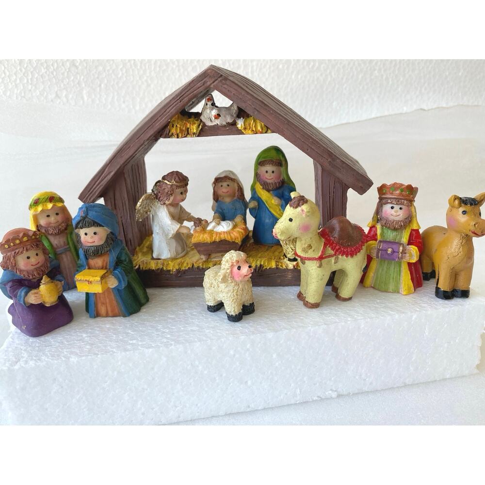 Mini Christmas Nativity Set featuring a resin stable and nine hand-painted figu